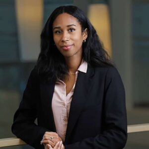 Executive headshot of a woman in a modern office building