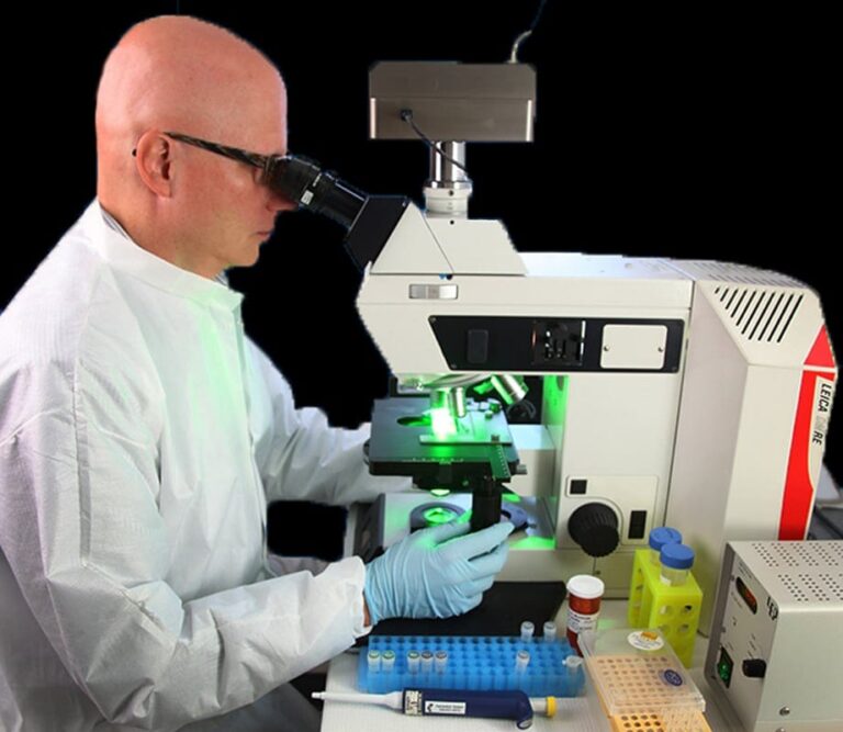 Scientist at a microscope in a laboratory