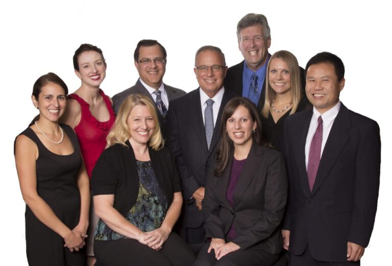 Medical practice team portrait on a white background