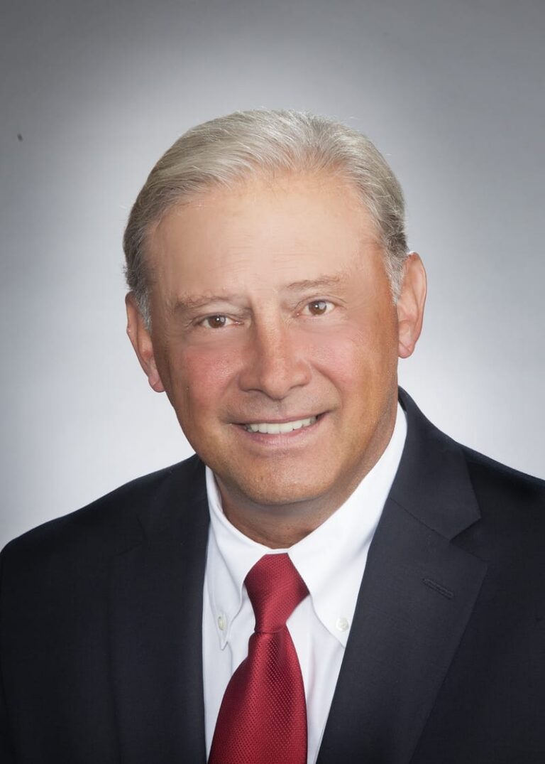 Team headshot on a gray backdrop from a matched company set