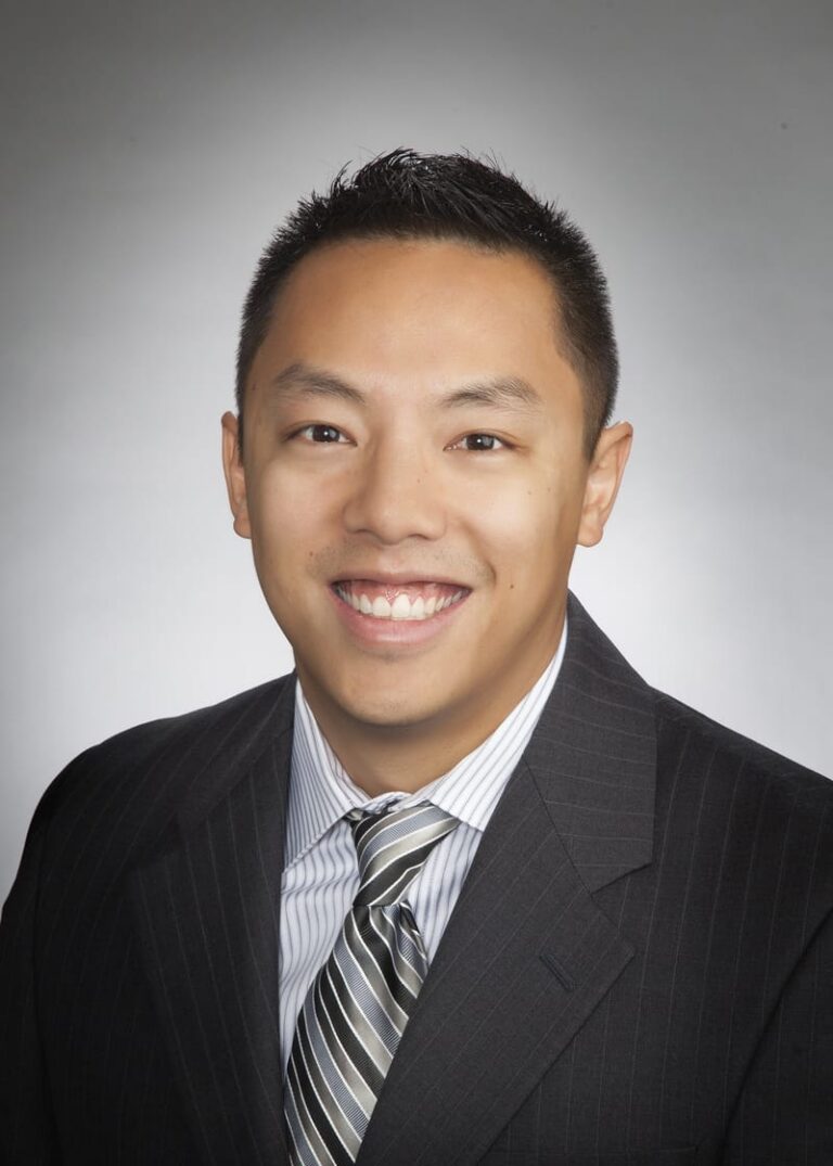 Team headshot on a gray backdrop from a matched company set